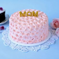 A peach rosette cream cake adorned with delicate flowers, a heartfelt tribute for Mom's special day.