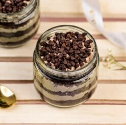 Two jars of delicious sweet cream cake with choco chips, perfect for satisfying dessert cravings and indulging in sweet flavors.