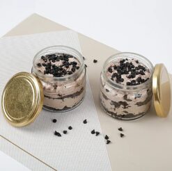 Two jars of decadent chocolate cakes, perfect for indulging in rich sweetness.
