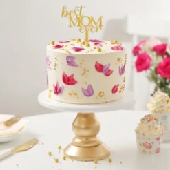 Mother's Day floral cake with beautiful blooms on layers of moist goodness, perfect for celebrating mom's special day.