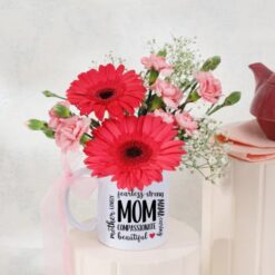 Vibrant gerbera arrangement, a delightful expression of love for Mother's Day. Brighten her day with this stunning bouquet in assorted colors.