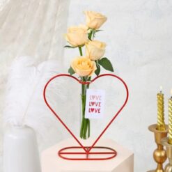 Heart-shaped planter filled with beautiful blooms, symbolizing love and affection.
