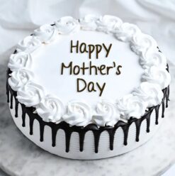 A decadent Black Forest cake, perfect for indulging Mom on Mother's Day with rich chocolate and cherry flavors.