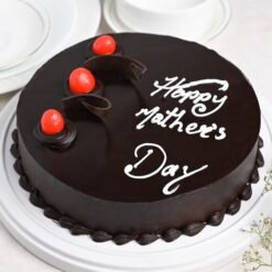 A heavenly chocolate cake adorned with decadent decorations, perfect for indulging in Mom's sweetest cravings.