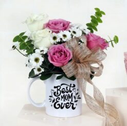 Mother's Day Blooming Mug Tribute - A heartfelt arrangement to celebrate Mom's love. Order now for a special surprise!