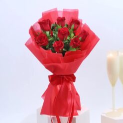 Vibrant red roses bouquet arranged beautifully in a vase, perfect for expressing love and passion on special occasions.