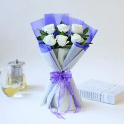 White roses bouquet for serene occasions, symbolizing purity and grace, beautifully arranged for gifting.