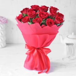 Vibrant red roses arranged beautifully in a bouquet, symbolizing love and passion.