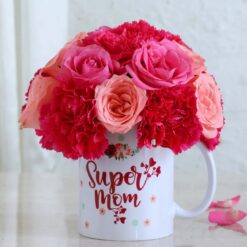Super Mom's Mug Blossoms - A charming floral arrangement nestled in a mug, perfect for celebrating Mom's special day. Order now!