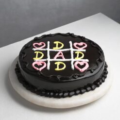 Chocolate cake with 'Dad's Chocolate Delight' inscription, perfect for Father's Day celebrations and special occasions.