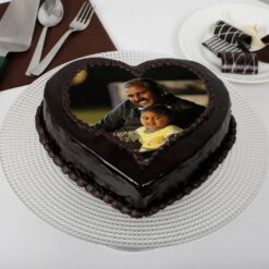 Dad's Heartfelt Truffle Photo Cake: A heart-shaped delight adorned with personalized photographs, perfect for surprising Dad on any occasion.