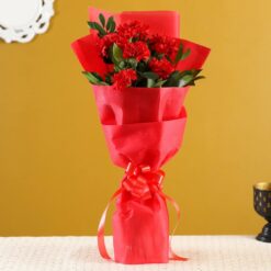 Vibrant bouquet of red carnations, ideal for expressing love and admiration, or adding warmth to any setting.