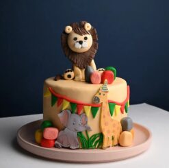 Jungle Jubilee Fondant Cake with vibrant jungle-themed designs and adorable animal figures, ideal for adventurous celebrations.
