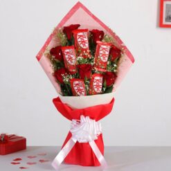 Bouquet of red roses paired with Nestle Kitkat chocolates, perfect for expressing love and affection on any occasion.