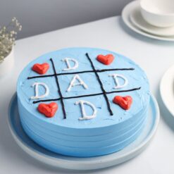 Blue themed cake with decorations for Dad's celebration, perfect for showing love and appreciation on his special day.
