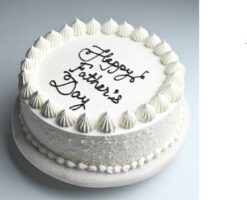 Classy vanilla cake with elegant decorations, perfect for celebrating Dad's special day with style and appreciation.