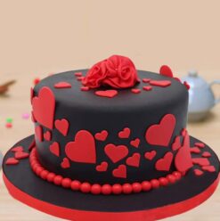 Elegant round fondant cake with smooth icing and customizable designs, perfect for special occasions.
