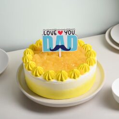 Pineapple cake with 'Love You Dad' message, perfect for celebrating Father's Day with sweet appreciation and affection.