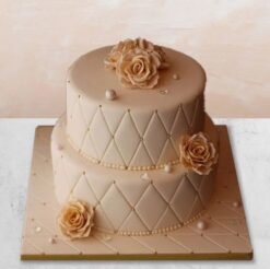 Fondant two-tier cake with elegant decorations, ideal for weddings and special occasions