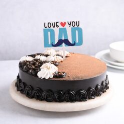 Decadent truffle cake adorned with a heartfelt 'Love You Dad' topper, crafted to celebrate Father's Day in sweet style.