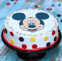 Cheerful Mickey Mouse cake featuring iconic Disney character decorations, ideal for birthday celebrations and Disney-themed parties