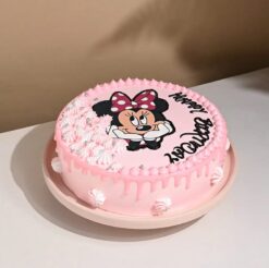 Minnie Mouse cake decorated with fondant bows and polka dots, ideal for birthdays and Disney-themed celebrations.