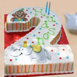 Number two cream cake with decorative icing, ideal for birthdays and celebrations.