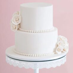Exquisite pearly white floral cake with delicate decorations, ideal for weddings and celebrations