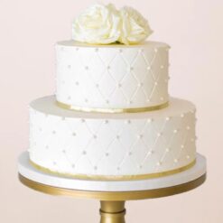 Beautiful rose two-tier cake with intricate floral decorations, ideal for weddings and special occasions